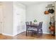 Cozy dining area featuring tile floors, a modern table set, and neutral wall color at 7984 Chase Cir # 68, Arvada, CO 80003