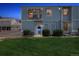 Charming townhome featuring a balcony, well-manicured lawn, and inviting curb appeal at 7984 Chase Cir # 68, Arvada, CO 80003