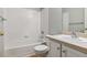 Clean bathroom with tub, toilet and single sink vanity at 9818 E Carolina Pl, Aurora, CO 80247