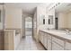 Bright bathroom with double vanity sinks, a soaking tub, and tiled flooring at 9818 E Carolina Pl, Aurora, CO 80247
