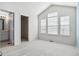 Bright bedroom features vaulted ceilings, natural light, and an ensuite bathroom at 9818 E Carolina Pl, Aurora, CO 80247