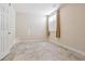 Neutral bedroom with large window, tile flooring, and plenty of natural light at 9818 E Carolina Pl, Aurora, CO 80247
