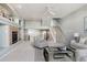 Open living room with high ceilings and a fireplace at 9818 E Carolina Pl, Aurora, CO 80247