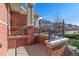 Brick porch with wrought iron railings at 9818 E Carolina Pl, Aurora, CO 80247