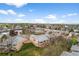 Areal view of backyard with a walkout basement and deck overlooking the green lawn at 4927 Greenwich Way, Highlands Ranch, CO 80130