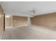 Spacious finished basement with carpet flooring and ceiling fan at 4927 Greenwich Way, Highlands Ranch, CO 80130