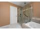 Bathroom includes glass shower stall and soaking tub for enhanced comfort at 4927 Greenwich Way, Highlands Ranch, CO 80130
