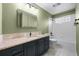 Bathroom with a modern vanity, granite countertop, and tiled shower and tub combo at 4927 Greenwich Way, Highlands Ranch, CO 80130