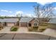 Charming single-story home with brick facade, two-car garage, and landscaped front yard at 4927 Greenwich Way, Highlands Ranch, CO 80130