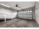 Spacious two car garage with concrete floor, and plenty of room for storage at 4927 Greenwich Way, Highlands Ranch, CO 80130