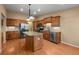 Spacious kitchen features wood cabinets, stainless steel appliances, and a granite island at 4927 Greenwich Way, Highlands Ranch, CO 80130