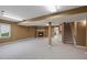 Spacious living room includes a brick fireplace and neutral carpeting at 4927 Greenwich Way, Highlands Ranch, CO 80130