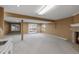 Spacious living room offers fireplace and sliding glass doors for natural light at 4927 Greenwich Way, Highlands Ranch, CO 80130