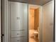 View of the updated bathroom with a shower and bathtub with a tile surround and neutral color scheme at 772 Victor St, Aurora, CO 80011