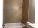 Bathroom with tiled shower-tub combo at 772 Victor St, Aurora, CO 80011