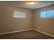 Bright bedroom featuring neutral paint, carpet flooring, and two windows with blinds for natural light at 772 Victor St, Aurora, CO 80011