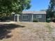 A quaint single-story home with a well-maintained lawn and simple landscaping leading up to the front door at 772 Victor St, Aurora, CO 80011