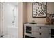 Bathroom featuring a tub with shower and modern artwork at 1631 N Emerson St # 117, Denver, CO 80218