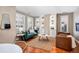 Inviting living room with natural lighting, built-in shelving and open floorplan at 1631 N Emerson St # 117, Denver, CO 80218