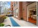 Charming patio with a table and chairs, ideal for enjoying outdoor dining and relaxation at 1631 N Emerson St # 117, Denver, CO 80218