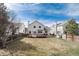 Well-kept lawn and backyard area with a deck and privacy fencing at 9866 Spring Hill Ln, Highlands Ranch, CO 80129
