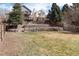 This expansive backyard has a rock wall at 9866 Spring Hill Ln, Highlands Ranch, CO 80129