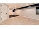 Basement with carpeted area and dark accent with windows offering natural light at 9866 Spring Hill Ln, Highlands Ranch, CO 80129