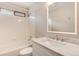 Bright bathroom featuring marble countertops, modern fixtures, and a shower-tub combination with tile surround at 9866 Spring Hill Ln, Highlands Ranch, CO 80129