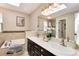 Bright bathroom featuring dual sinks, a soaking tub, and a large mirror reflecting a walk-in shower at 9866 Spring Hill Ln, Highlands Ranch, CO 80129