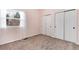 Bedroom with plush carpeting, natural light, a large window, and closet with sliding doors at 9866 Spring Hill Ln, Highlands Ranch, CO 80129