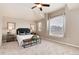 Spacious bedroom featuring a large window, plush carpeting, and elegant decor at 9866 Spring Hill Ln, Highlands Ranch, CO 80129