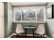 Breakfast nook featuring a round table with two chairs and a view of the neighborhood at 9866 Spring Hill Ln, Highlands Ranch, CO 80129