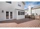 The backyard deck features french doors for indoor/outdoor living at 9866 Spring Hill Ln, Highlands Ranch, CO 80129