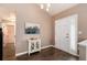 Welcoming entryway featuring a white console table, decorative art, and stylish lighting at 9866 Spring Hill Ln, Highlands Ranch, CO 80129