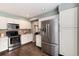 Bright kitchen featuring stainless steel appliances, light countertops, and wood-look flooring at 9866 Spring Hill Ln, Highlands Ranch, CO 80129