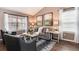 Bright living area with cozy seating, stylish decor, and natural light streaming through the windows at 9866 Spring Hill Ln, Highlands Ranch, CO 80129