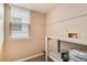 Storage room with shelving, a window, and utility hookups, offering ample storage space at 9866 Spring Hill Ln, Highlands Ranch, CO 80129