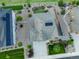 Aerial view of home featuring solar panels, stone landscaping, adjacent home, and green lawn at 3790 Mighty Oaks St, Castle Rock, CO 80104