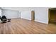 Finished basement with hardwood flooring, stairs to upper level, and neutral color palette at 3790 Mighty Oaks St, Castle Rock, CO 80104