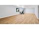 Spacious finished basement with hardwood flooring, natural light, and room for activities at 3790 Mighty Oaks St, Castle Rock, CO 80104