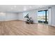 Finished basement with hardwood flooring, natural light, and sliding glass door access to yard at 3790 Mighty Oaks St, Castle Rock, CO 80104