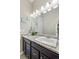 Bright bathroom features a vanity with granite countertop and stainless faucet and fixtures at 3790 Mighty Oaks St, Castle Rock, CO 80104