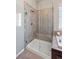 This bathroom features a large glass shower with built in seat and tile surround at 3790 Mighty Oaks St, Castle Rock, CO 80104