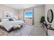 Serene bedroom featuring a large window with scenic views and stylish decor at 3790 Mighty Oaks St, Castle Rock, CO 80104