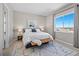 Bright bedroom featuring a large window with scenic views and neutral decor at 3790 Mighty Oaks St, Castle Rock, CO 80104