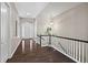 Inviting foyer with hardwood floors, a staircase and an entry door with sidelights and transom window at 3790 Mighty Oaks St, Castle Rock, CO 80104