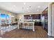 Open kitchen with granite counters, stainless steel appliances, and island seating at 3790 Mighty Oaks St, Castle Rock, CO 80104