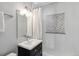 Bathroom with a glass shower, modern vanity, and stylish lighting at 3040 S Dexter Way, Denver, CO 80222