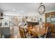 Open-concept living area with hardwood floors, dining area, and view of the kitchen at 3040 S Dexter Way, Denver, CO 80222