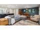 Open living area with a view to kitchen and dining room, offering ample seating and natural light at 3040 S Dexter Way, Denver, CO 80222